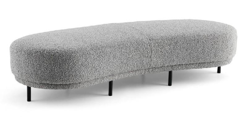 Contemporary bench with an organic pebble-shaped design, upholstered in soft grey bouclé fabric and supported by slim black legs